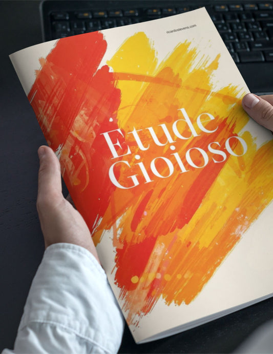 Book titled 'Etéd Gioioso' with colorful cover held by a person on a dark surface by Ricardo Stevens.